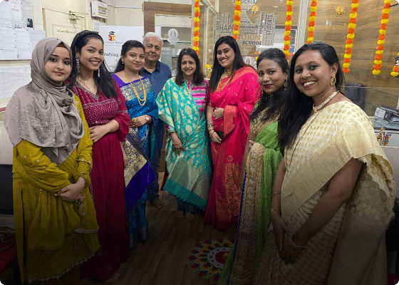 A group of office colleagues posing with a university delegate at the EduOptions’ Mumbai office.
